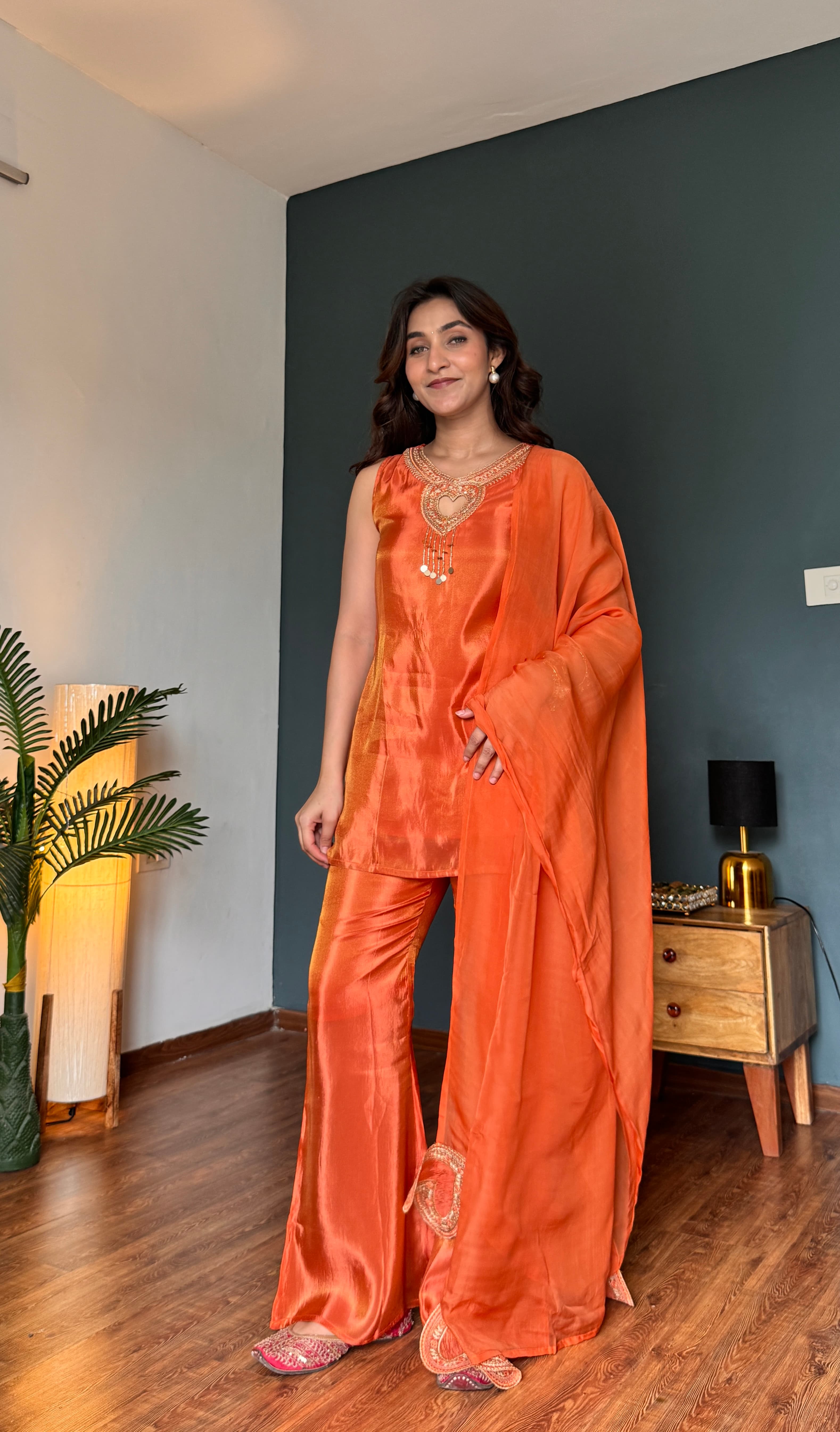 Heart-shaped gold zari embroidery at neckline