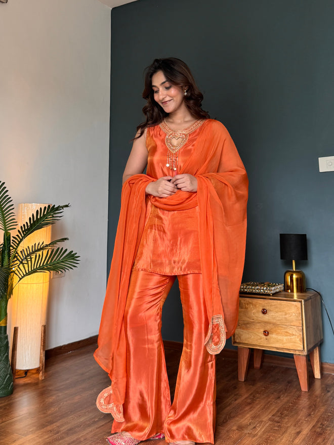 Heart-shaped gold zari embroidery at neckline