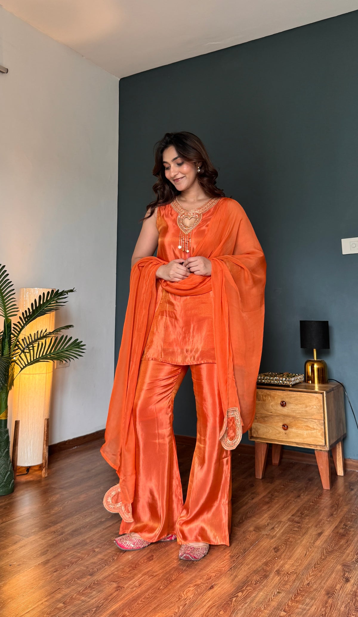 Heart-shaped gold zari embroidery at neckline