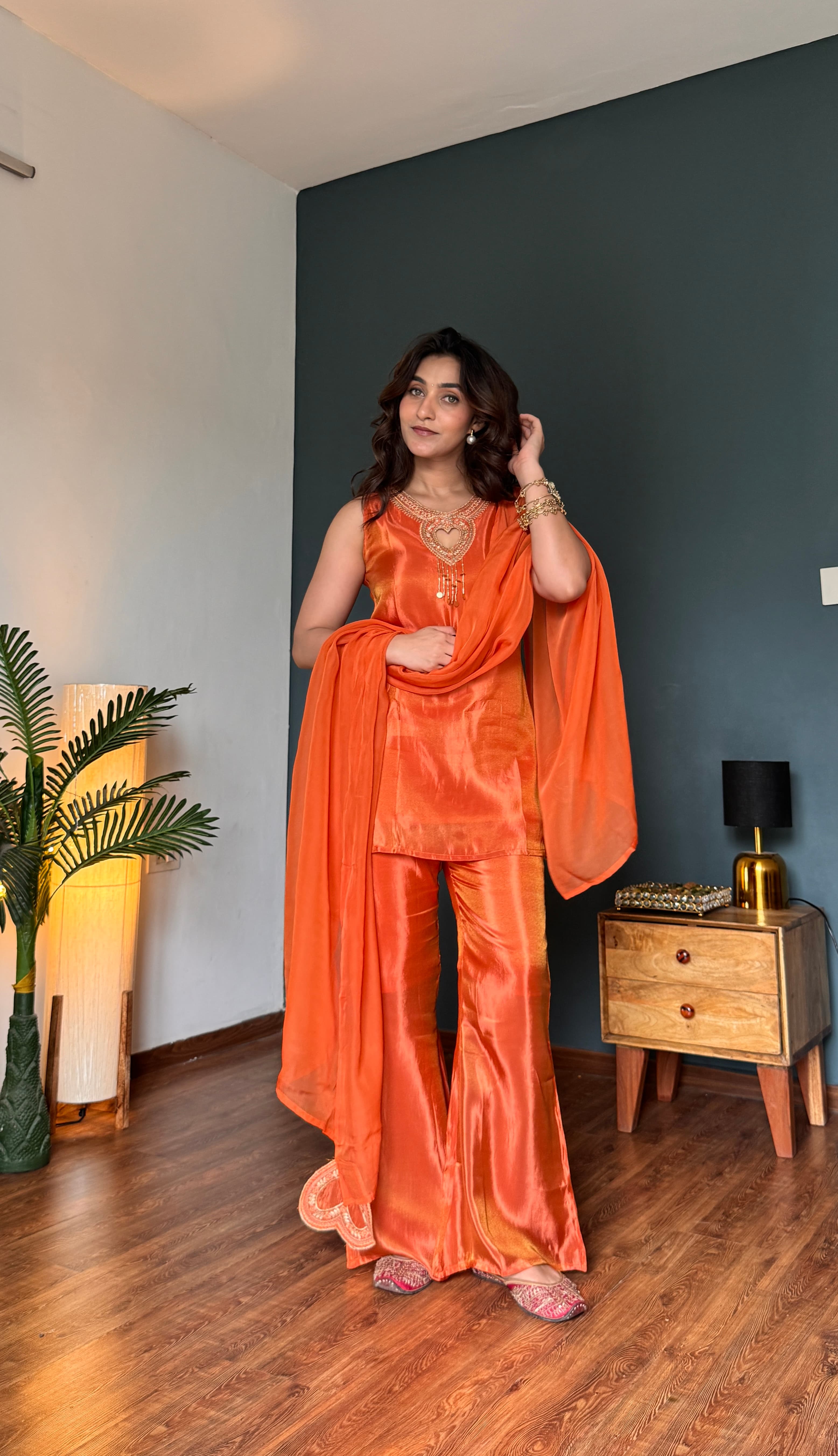Heart-shaped gold zari embroidery at neckline